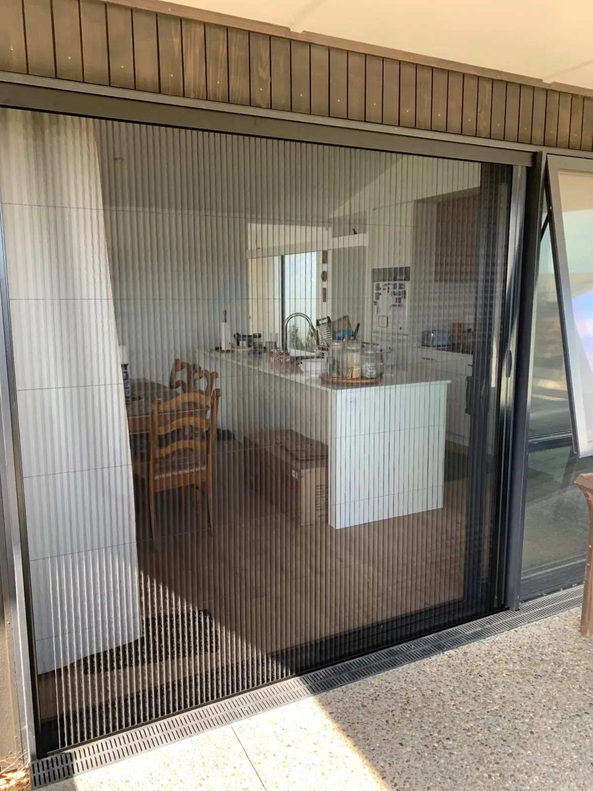 Brio folding screens across stacker doors into a Morrinsville kitchen