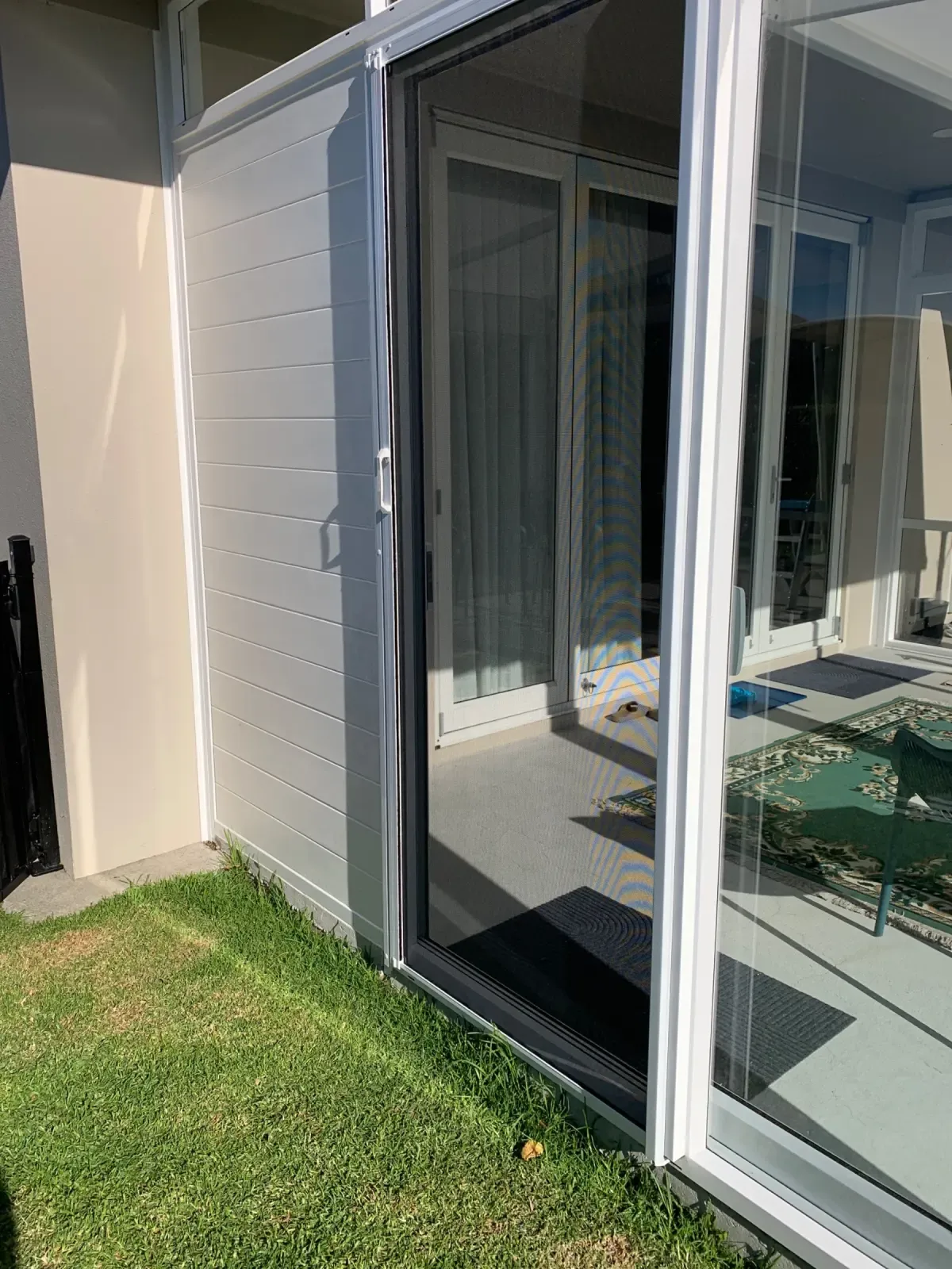 Appliance White MeshLock screen on a patio slider at a pet-friendly Tauranga home