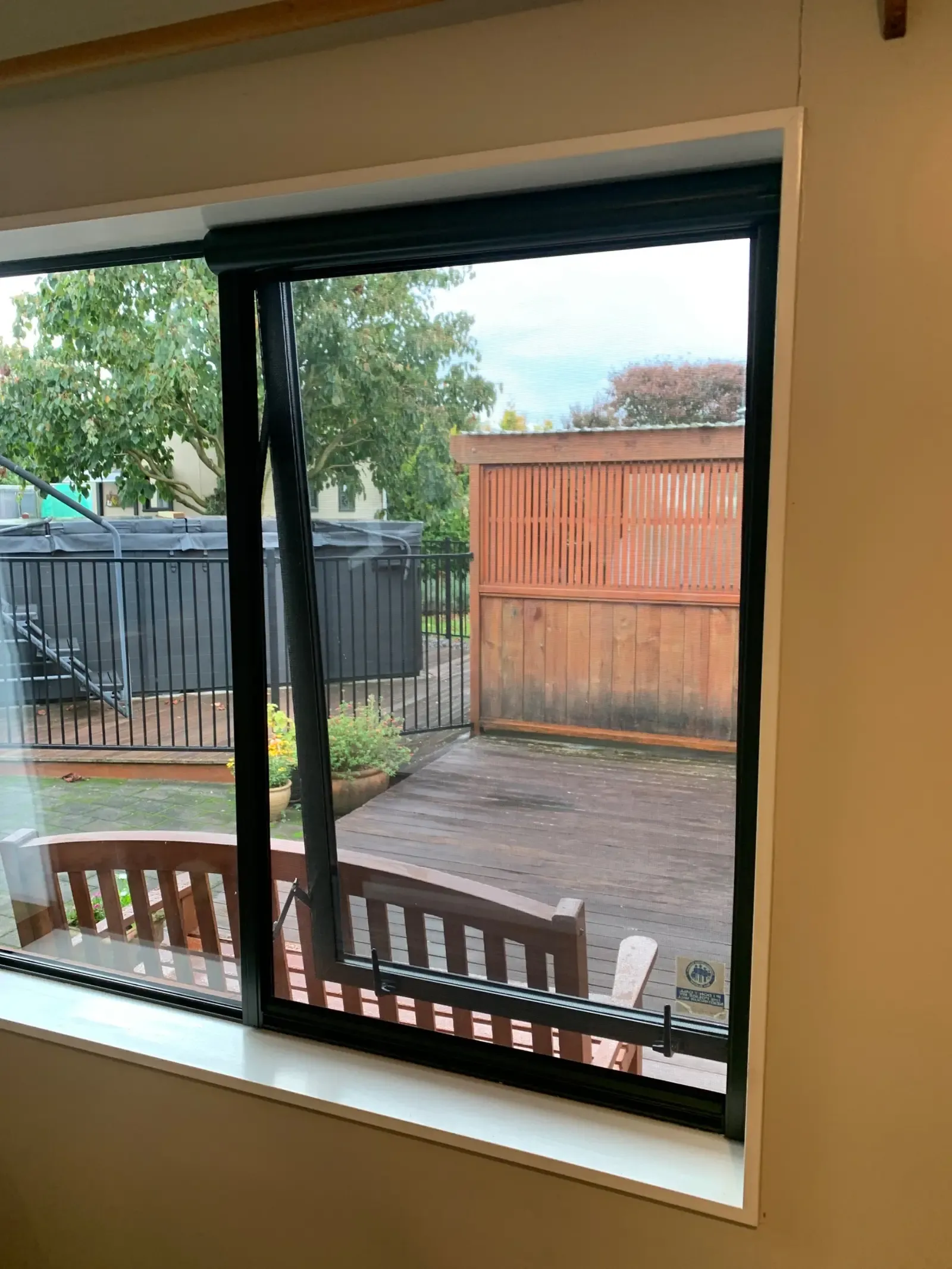 Serene retractable screen on a bedroom window, deck and spa pool beyond