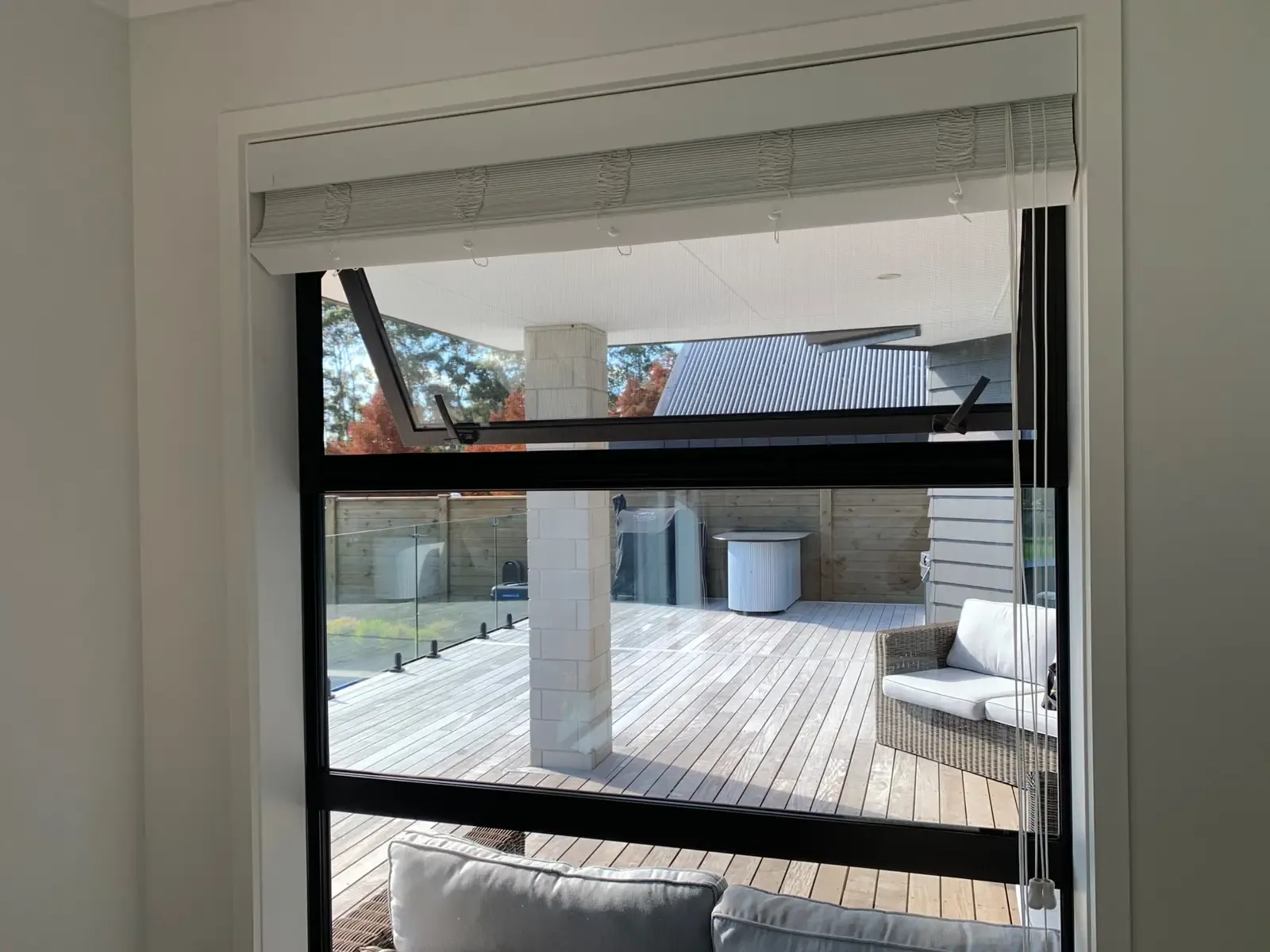 Serene screen over a bedroom awning window, pool deck below