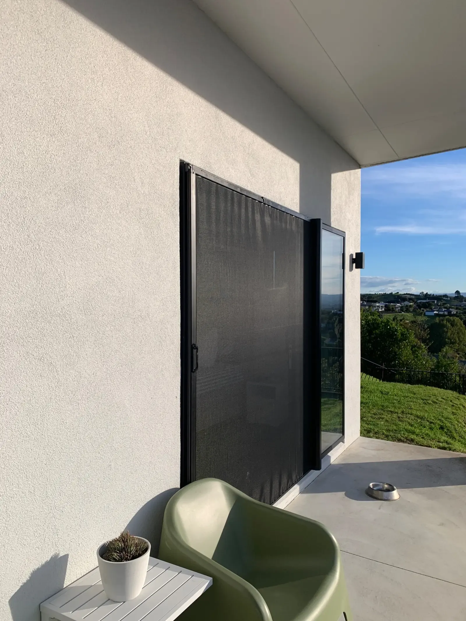 Wall Screen drawn across a bedroom slider on a hillside patio, Tauranga